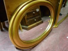 A gilt framed over wall mirror