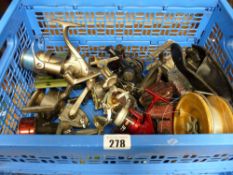 A crate of fishing reels & associated items