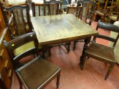 An oak draw leaf dining table on barley-twist supports, three bergere backed dining chairs & two