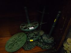 A parcel of painted kitchen cast trivets & stands etc