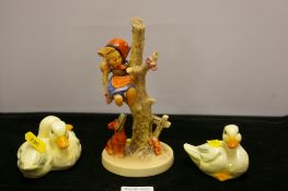 A Goebel figure & two Goebel duck ornaments