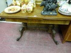 A continental walnut draw leaf dining table