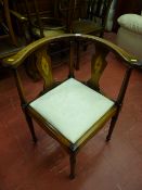 A reproduction mahogany corner armchair with Sheraton-type detail