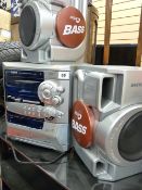 A Sanyo compact HI-FI system with speakers and a glass and chrome entertainment stand E/T