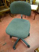 An upholstered swivel office chair