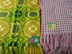 TWO TRADITIONAL WELSH WOOL BLANKETS with labels, a typically patterned bedspread in mustard tones