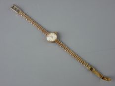 A LADY'S NINE CARAT GOLD CIRCULAR DIAL LONGINES WRISTWATCH with four bar nine carat gold bracelet,