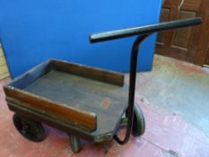 A VINTAGE ENGINEER'S FOUR WHEELED TRUCK by Edward Deane & Beal of London, complete with hinged