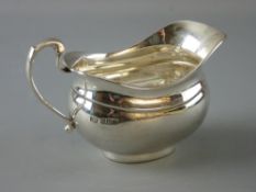 AN OVAL SILVER MILK JUG, 6.2 troy ozs, Sheffield 1934