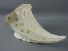 A LARGE BELLEEK (blue mark) HORN SHAPED VASE with shamrock decoration, 29 cms long
