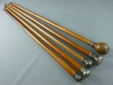 FIVE MALACCA WALKING CANES with white metal mounts, 91 cms long the longest
