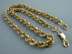 A NINE CARAT GOLD TRIPLE TWIST NECKLACE, 19 grms