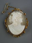 A NINE CARAT GOLD MOUNTED CAMEO BROOCH with pendant loop attachment and safety chain, 7.5 grms