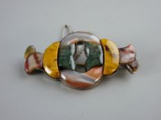 A MULTI-COLOUR SCOTTISH AGATE BROOCH set in unmarked white metal with safety chain, 6.75 cms long
