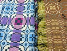 TWO VINTAGE TRADITIONAL WELSH WOOLLEN BLANKETS, both tassel ended in purple and blue tones, the