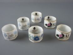 SIX WEDGWOOD CHINA FLORAL NAPKIN RINGS, various patterns