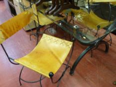 Stylish modern glass topped dining table and a set of eight (six plus two) hide and wrought iron
