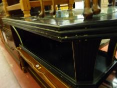 Modern ebonized coffee table with glass top and brass effect edging