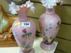 Pair of pink milk glass floral decorated vases