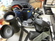 Parcel of vintage photography equipment including flashbulbs, two Nikon cameras, lenses by Nikon