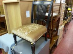 Edwardian ebonized parlour chair on brass front castors and a mahogany bedroom chair with carved