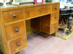 European walnut pedestal type desk and an ebonized display table on turned and fluted supports