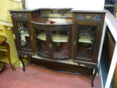 Circa 1900 mahogany side cabinet with bow centre doors and under tier shelf