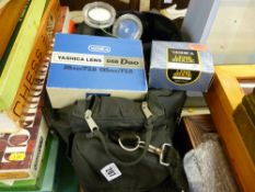 Quantity of camera lenses in a canvas holdall