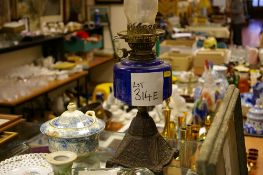 Iron based oil lamp with blue glass reservoir