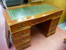 Excellent reproduction mahogany pedestal desk with gilt tooled green leather insert