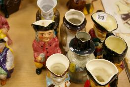Nine small and medium sized Toby jugs - various makers