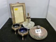 Silver photograph frame, a pair of three footed salts with blue liners and two glass dressing