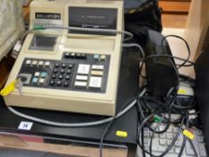 Compact retail till with cash drawer, a Sharp desktop printing calculator and a forged bank note