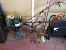 Petrol driven rotovator with accompanying attachments