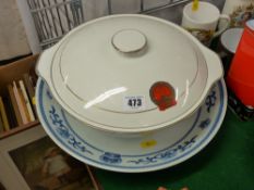 Blue and white dish and a tureen and cover, both having the emblem for The People's Republic of