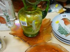 Green Mary Gregory glass jug with fluted rim and three carnival glass footed dishes