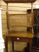 Mahogany two tier table, loom style linen basket and a canework magazine rack table