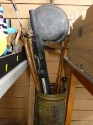 Brass stickstand with contents of sticks, umbrellas, vintage golf clubs and a bedwarming pan