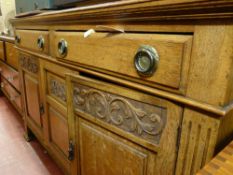 Circa 1900 oak sideboard with carved door detail