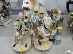 Pottery terrier and a quantity of pottery figurines