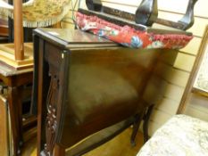 Edwardian mahogany Sutherland table and an upholstered top footstool