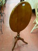 Oval tilt top tripod table