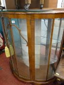 Bow front walnut china display cabinet