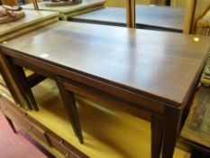 Nest of three teak tables