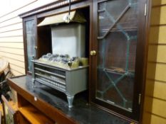 Ornate fire surround with accompanying electric fire E/T