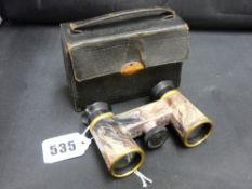 Cased set of marbled bakelite opera glasses