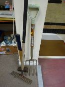 Garden rake, fork and a sledgehammer