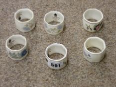 Six Wedgwood bone china floral decorated napkin rings