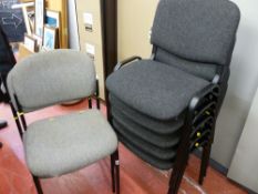 Seven modern upholstered stacking office chairs