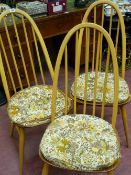 Three light wood Ercol stick back chairs